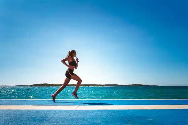 Woman running showing strong leg muscle Margate
